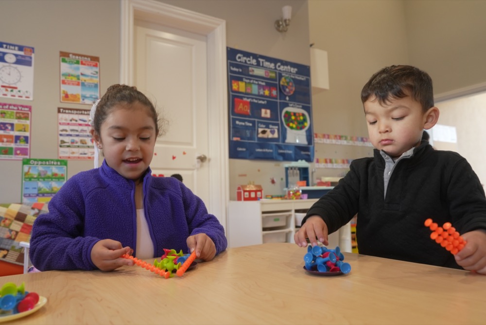 Children enjoying evening activities at Little Explorers