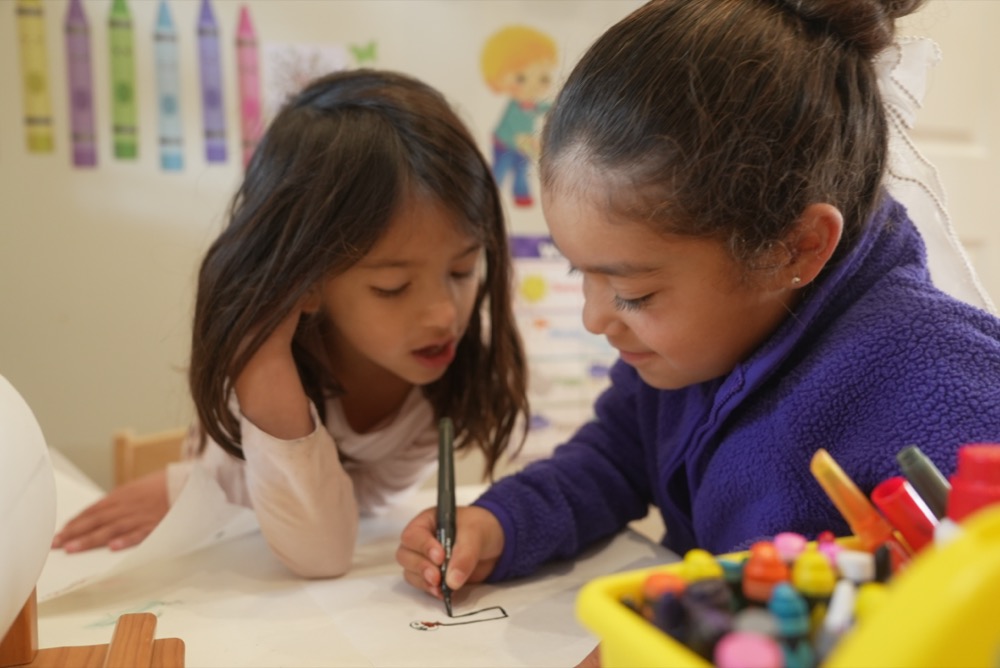 Children drawing together