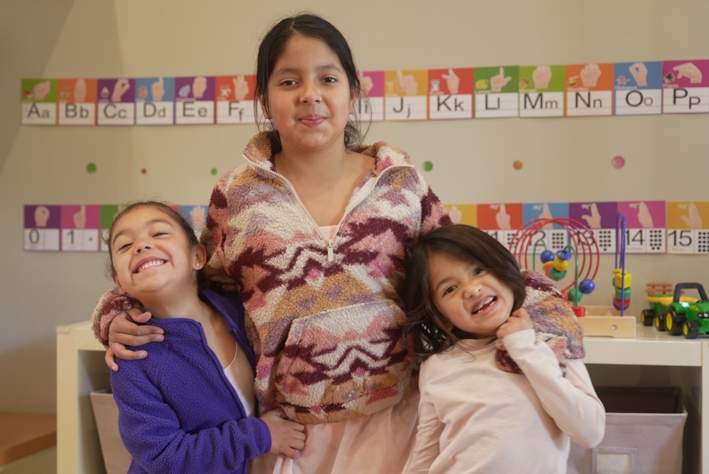 Happy children smiling at Little Explorers Daycare